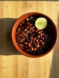 roasted chickpeas in a bowl on a wooden table